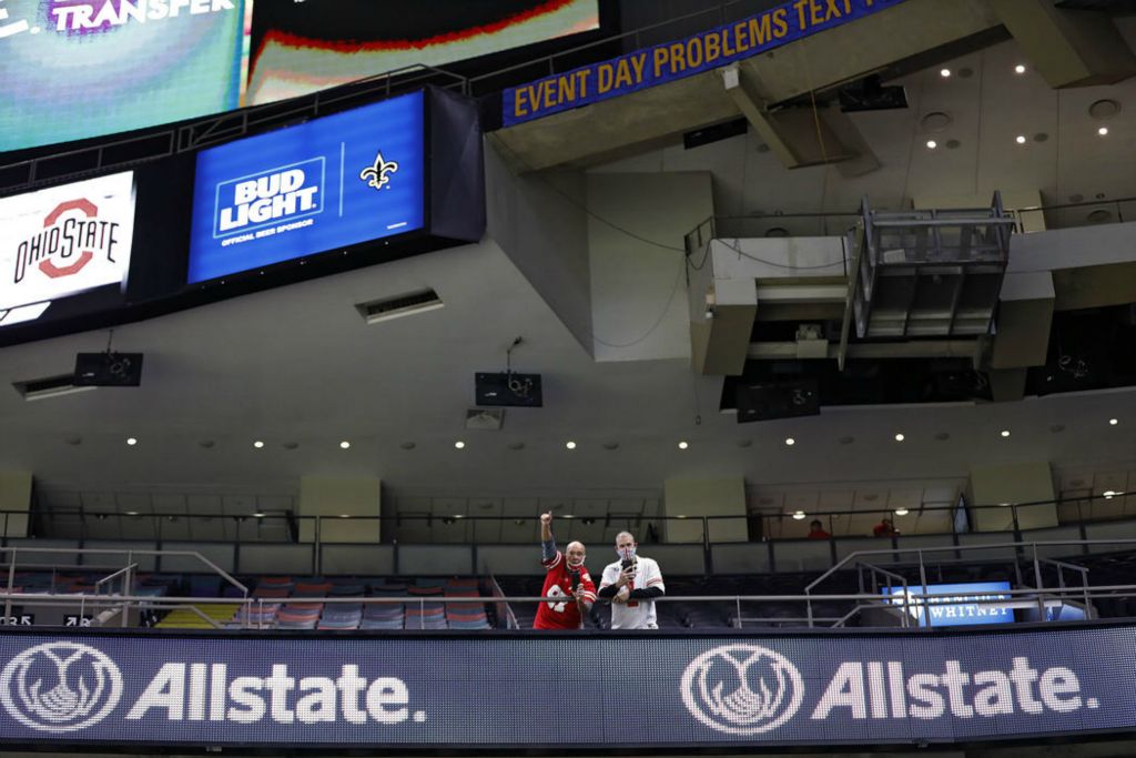 Story - 1st place - January - Ohio State fans cheer as the team enters the  Mercedes-Benz Superdome before taking on Clemson Tigers during the College Football Playoff semifinal at the Allstate Sugar Bowl in New Orleans. (Kyle Robertson / The Columbus Dispatch)