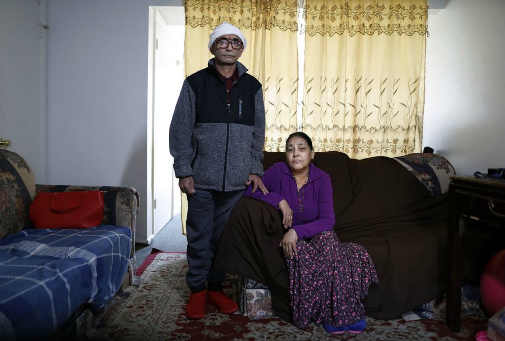 Portrait - 1st place - November - Padam Lal Khatiwada and his wife, Devi, lost everything in a fire on Tamarack Blvd. The apartment complex mainly houses refugees. They pose for a photo in a family friends apartment they are living in for time being.(Kyle Robertson / The Columbus Dispatch)