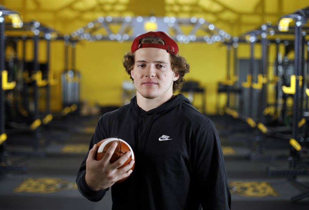 Portrait - 1st place - December - Upper Arlington running back Carson Gresock is the 2021 All-Metro offensive player of the year after rushing for over 2,500 yards and breaking school records. He poses for a photo in the weight room at Upper Arlington High School. (Kyle Robertson / The Columbus Dispatch) 