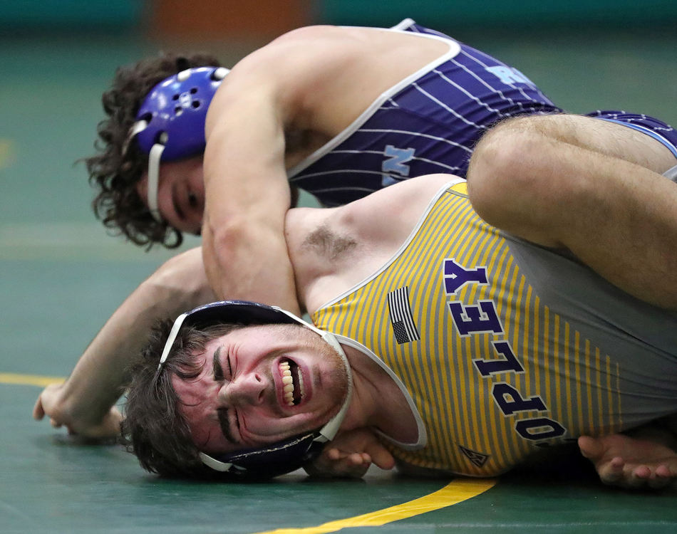 Sports - 1st place - Drew Humprys of Copley (bottom) winces in pain as Nick Malek of Rootstown puts him in a half nelson during their 138 pound match in the Bill Dies Memorial Wrestling Tournament at Firestone High School in Akron. (Jeff Lange/Beacon Journal / Akron Beacon Journal)