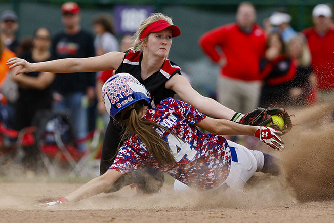 SPSports - HM - Groveport-Madison shortstop Lanie White (top) misses the tag on Marysville's Jenna Bresnahan as she slides into second base in their Division I district championship game at Pickerington High School. (Joshua A. Bickel / ThisWeek Community News)