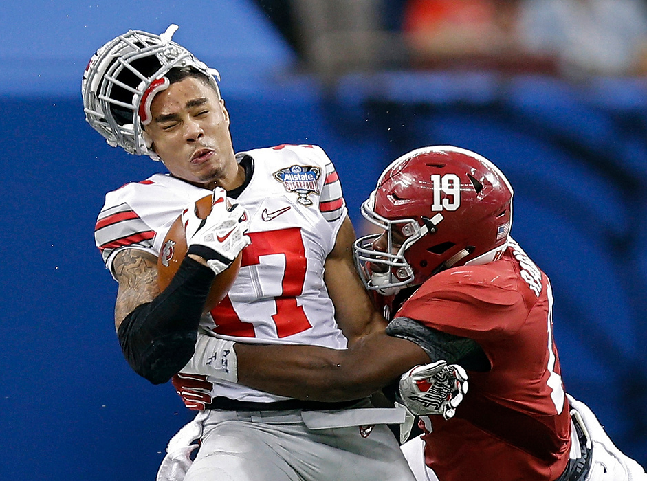 Award of Excellence, Sports Action - Kyle Robertson / The Columbus DispatchOhio State running back Jalin Marshall (17) gets tackled by Alabama linebacker Reggie Ragland (19) during the 3rd quarter of the Sugar Bowl at the Mercedes-Benz Superdome in New Orleans, on January 1, 2015. 