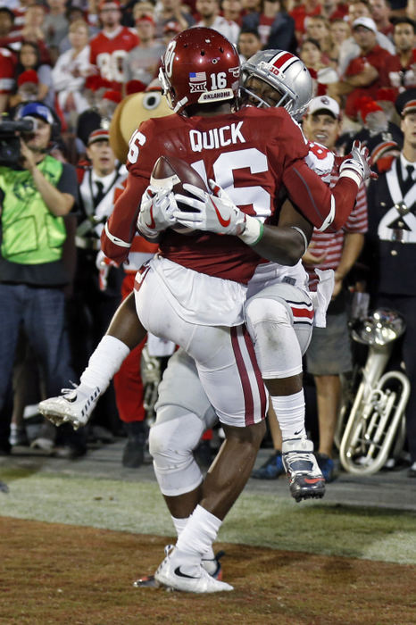 Second Place, Sports Action - Kyle Robertson / The Columbus DispatchOhio State Buckeyes wide receiver Noah Brown (80) makes his third touchdown catch in the first half against Oklahoma Sooners defensive back Michiah Quick (16) at Oklahoma Memorial Stadium.  