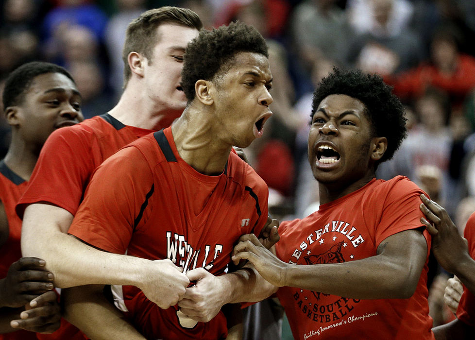 Second Place, Sports Feature  - Kyle Robertson / The Columbus DispatchWesterville South Jordan Humphrey (3) celebrates after making the game winning shot against Lima Senior in the Division I championship game at Value City Arena in Columbus.
