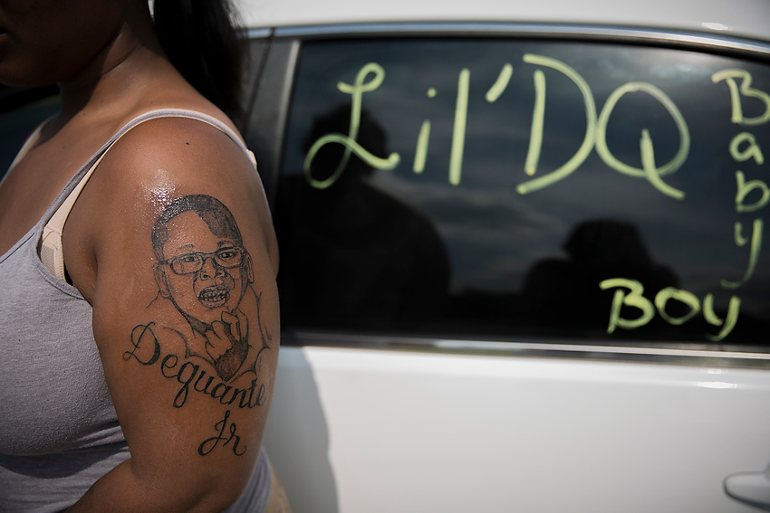 First Place, Feature Picture Story - Liz Moughon / Ohio UniversityMicheshia tattooed her arm with her son's face and reminds the Louisville community of her loss by diligently painting her car windows in memory of him.