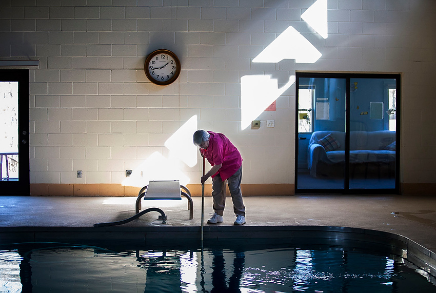 Award of Excellence, Feature Picture Story - Erin Clark / Ohio UniversitySister Loretta cleans the pool at Sacred Heart Retreat Center, owned by the St. Ambrose Parish. The Retreat Center had been built by a wealthy doctor in the 1980s and was eventually donated to the parish with the agreement that it would be used for the community and tended to by two nuns. The Retreat Center is used for all sorts of events, not strictly religious, but it is the hope of  Sister Loretta that they will leave a positive and accepting influence on the community. 