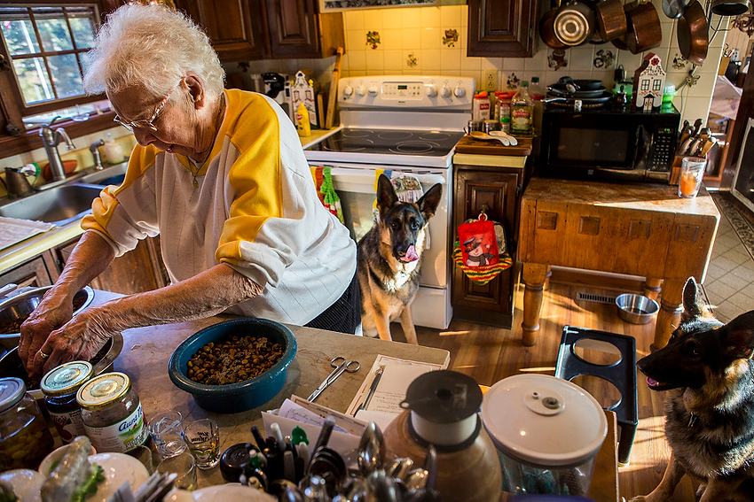 Award of Excellence, Feature Picture Story - Erin Clark / Ohio UniversityRita Marie Von Berg, a 94-year-old retired nun, prepares tripe for her two german shepherds. Rita is 94-years-old and lives with two other retired nuns who she met while working as the director for Saint Joseph’s hospital. 