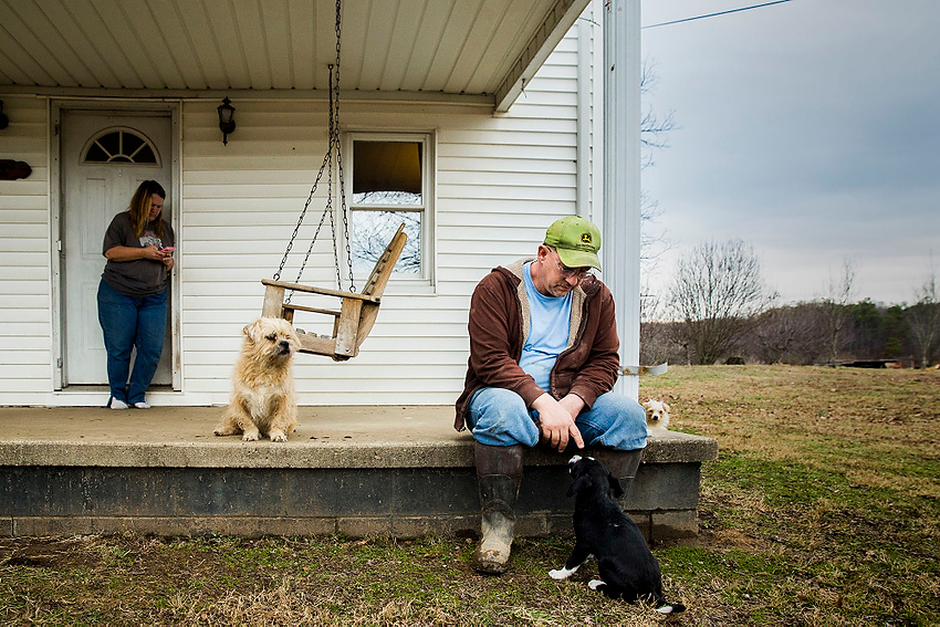 Award of Excellence, Feature Picture Story - Erin Clark / Ohio UniversityJohn Murphy sits on the porch of his farmhouse after feeding his cows. The Murphy farm has been in the family since the  1950's. 