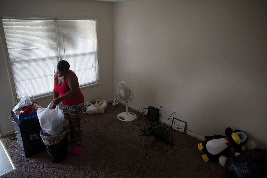 First Place, Feature Picture Story - Liz Moughon / Ohio University"When I go in that house it's evil," Micheshia says as she packs up her old house where Dequante was shot. "I feel it should be nobody else moving in that house. It's a danger hazard, especially if a person has children."