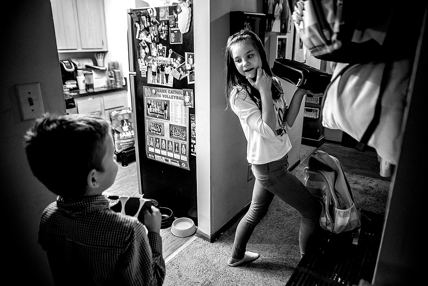 Award of Excellence, Feature Picture Story - Jessica Phelps / Newark AdvocateLera packs up her backpack for school before getting ready for bed. The kids speak minimal English and are all taking ESL classes at their school. Their parents worry about them catching up with their classmates. 