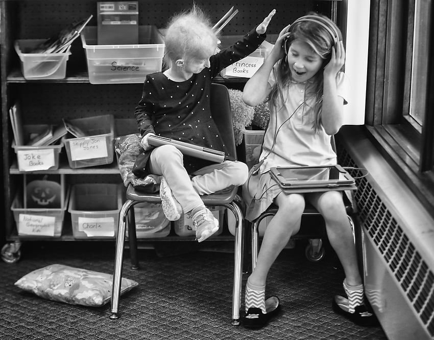 Award of Excellence, Feature Picture Story - Jeremy Wadsworth / The Blade  Carly Kudzia, 7, who has progeria, plays with her friend Quinn Bublick, 6, at Lial Elementary School in Whitehouse, Ohio.