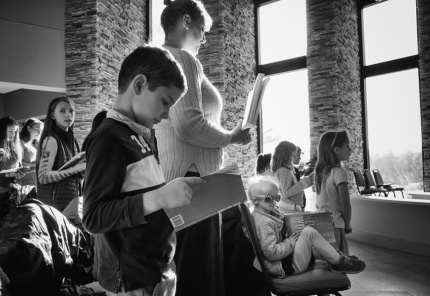 Award of Excellence, Feature Picture Story - Jeremy Wadsworth / The BladeCarly Kudzia, 7, who has progeria, attends mass with her classmates and teacher Heather Hughes at Lial Elementary School in Whitehouse, Ohio.