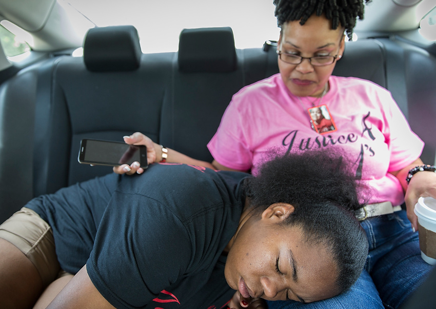 First Place, Feature Picture Story - Liz Moughon / Ohio UniversityMicheshia rests on her mother, Priscilla's, lap. Family is still Micheshia's life blood.