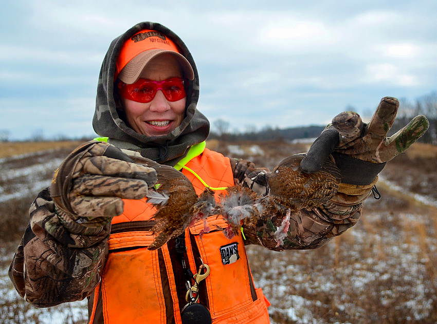 Award of Excellence, Feature Picture Story - Aaron Self / Kent State UniversityJennifer Nign holds up what remains of a quail after it had been shot almost at point blank range.