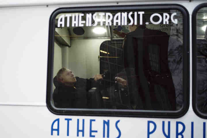 First place, Larry Fullerton Photojournalism Scholarsahip - Alexandria Skowronski / Ohio UniversityOfficers Andy Foster, Neal Dicken, and Ethan Doerr of Athens Police Department speak to a passenger of an Athens Transit bus who was in mental distress. The officers got the man calmed down and the bus was able to take him home.  (Alexandria Skowronski/Ohio University)