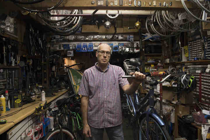 First place, Larry Fullerton Photojournalism Scholarsahip - Alexandria Skowronski / Ohio UniversityJohn Lefelhocz, of Macedonia poses for a portrait in his shop,CyclePath in Athens. Lefelhocz has been the co-owner of CyclePath since 1985.  (Alexandria Skowronski/Ohio University)