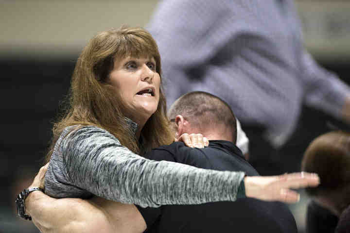 First place, Larry Fullerton Photojournalism Scholarsahip - Alexandria Skowronski / Ohio UniversityA spectator reacts as Ohio University's Austin Reese of Urbana passes out during the second period of a match and stops breathing for approximately three minutes. Reese was conscious when he was taken to the hospital.  (Alexandria Skowronski/Ohio University)