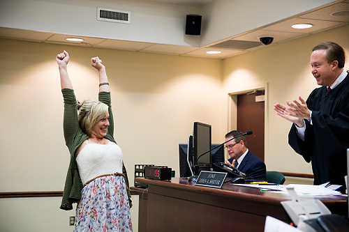 1st place, General News - Meg Vogel / The Cincinnati EnquirerCheri Lee celebrates passing her massage therapist license test with Probate/Juvenile Judge James A. Shriver, during Clermont County Family Dependency Treatment Court in Batavia. The court was set up to help families torn apart by drug abuse by providing them support to find housing, jobs and counseling. 