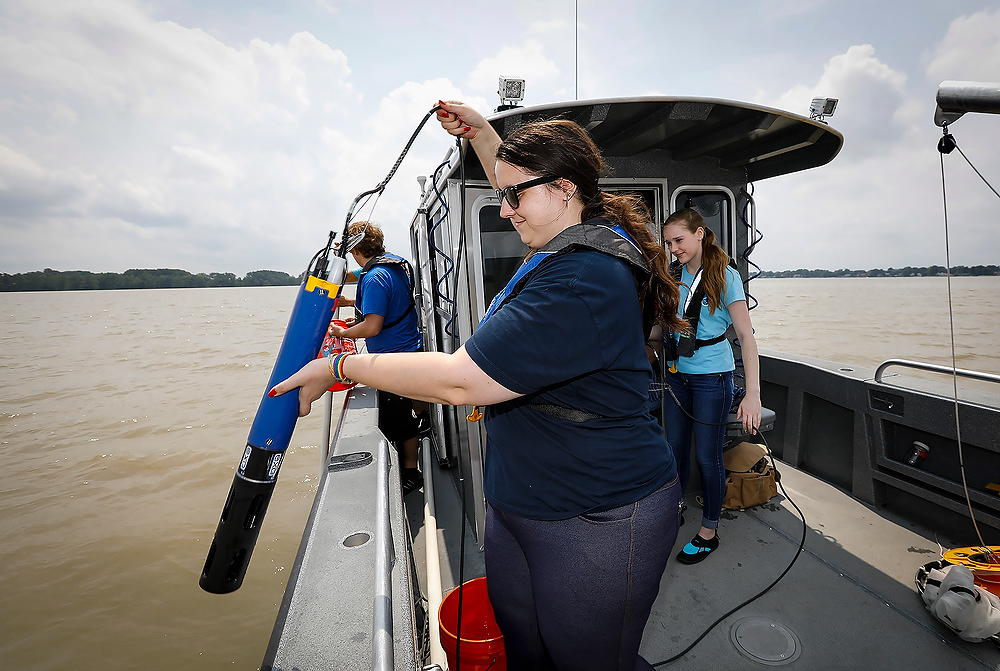 Second Place, News Picture Story - Andy Morrison / The BladeUniversity of Toledo graduate student Eva Kramer retrieves a multiparameter sonde as they study water quality on Lake Erie.
