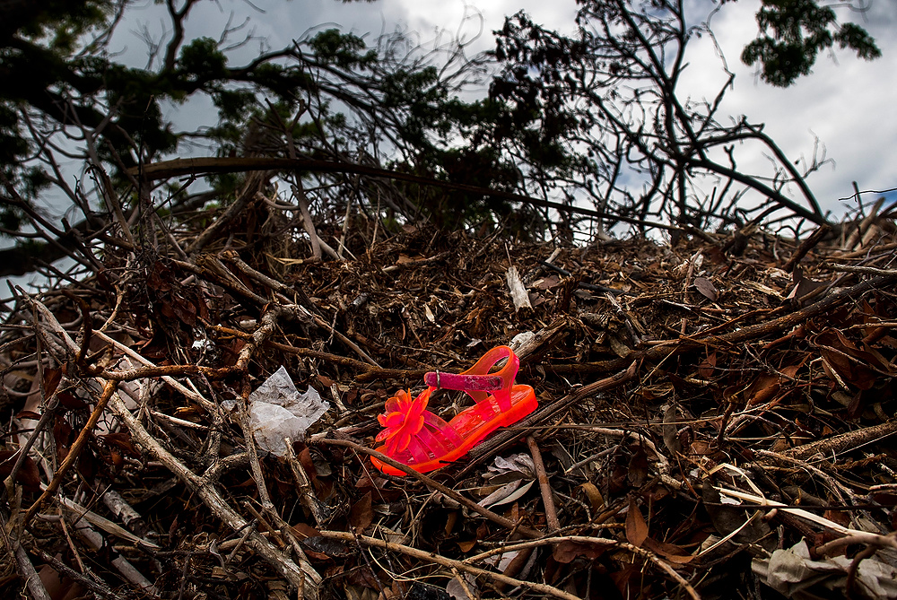 Award of Excellence, News Picture Story - Aaron Self / Kent State UniversityTrash and debris cover the Florida Keys, ranging in size from this tiny children's shoe all the way up to cars and large boats.