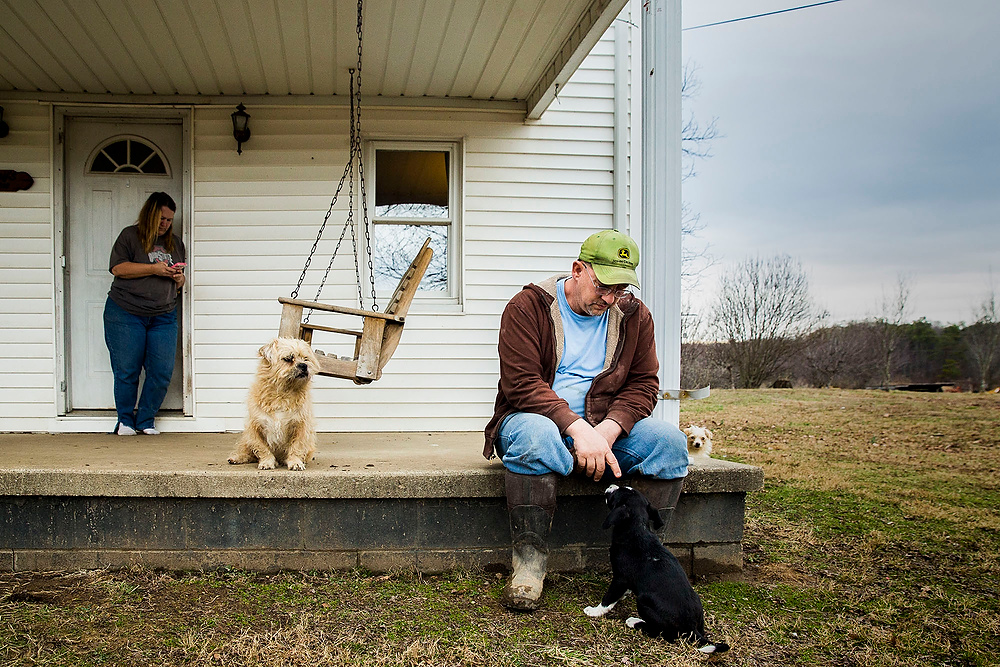 First Place, James R. Gordon Ohio Understanding Award - Erin Clark / Ohio UniversityJohn Murphy sits on the porch of his farmhouse after feeding his cows. The Murphy farm has been in the family since the  1950's. 