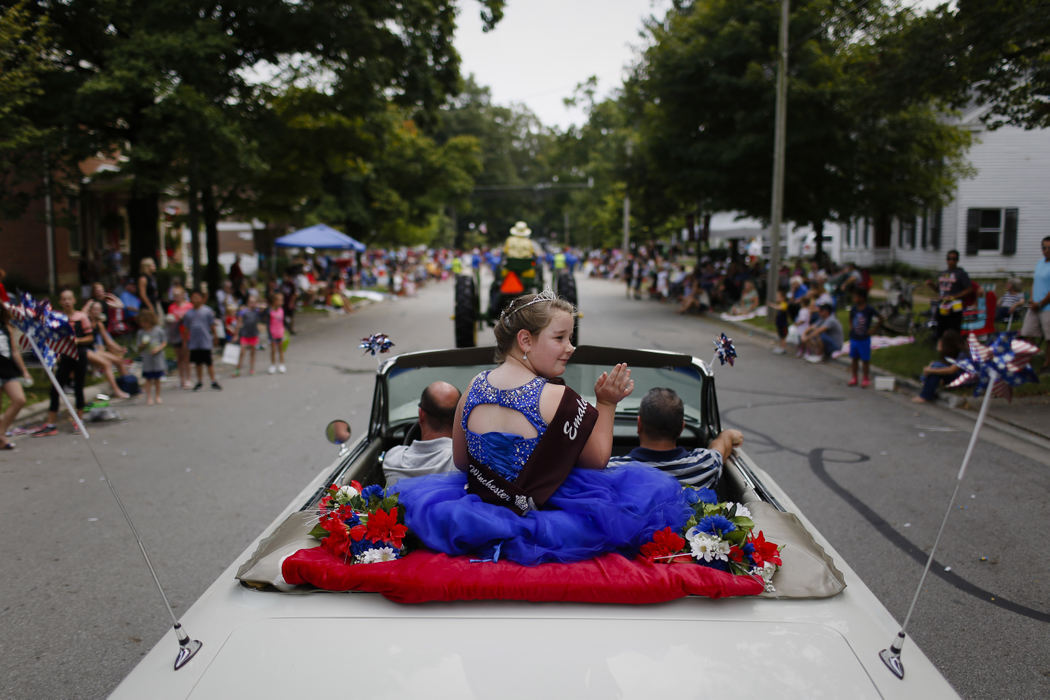 Seven-year-old Emalee Anderson, the 2016 Tiny Miss Canal Winchester, waves to spectators as she rides in the back 1962 Chevrolet Impala during the Labor Day parade on Monday, September 4, 2017 in Canal Winchester, Ohio.