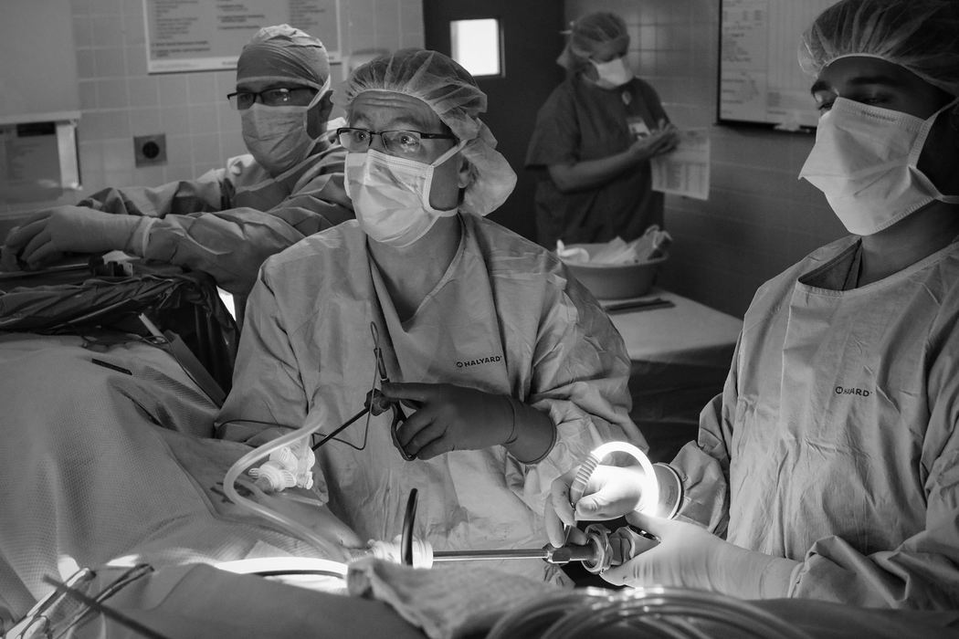 Dr. Ronald Pelletier, center, looks at a video monitor as he uses surgical scissors to cut away tissue surrounding one of Ann's kidneys at the beginning of the procedure on Tuesday, February 14, 2017 at The Ohio State University Wexner Medical Center in Columbus, Ohio.