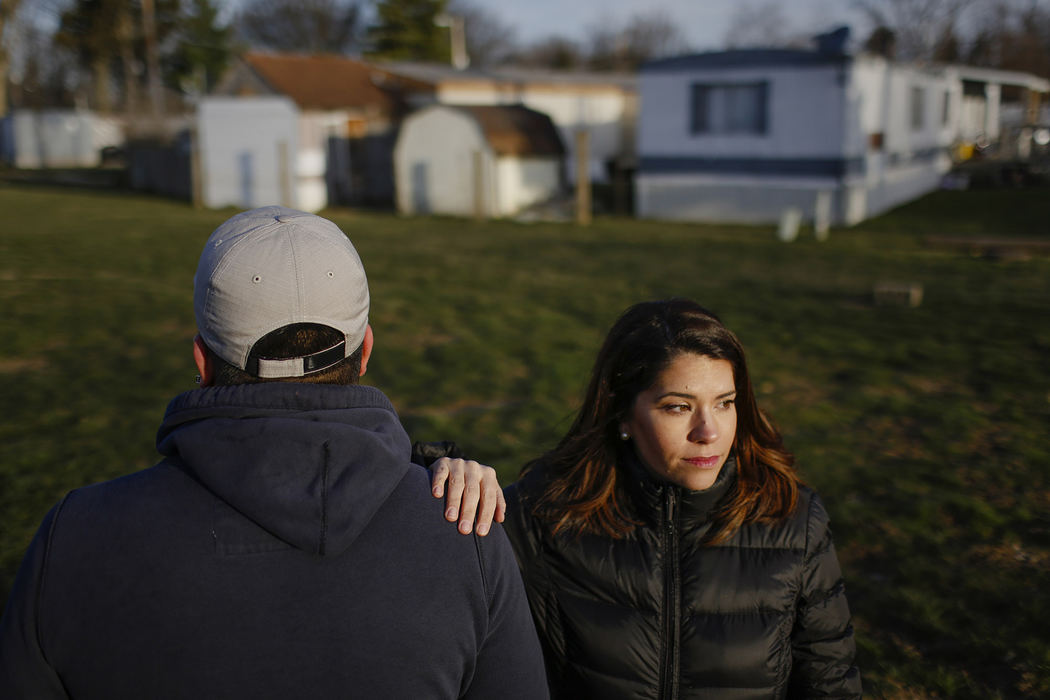 Immigration attorney Jessica Rodriguez Bell poses for a portrait with one of her clients, a mid-20s man who emigrated illegally from Mexico, at the mobile home park where he lives in northeast Columbus, Ohio on March 23, 2017. When the man was 10 months old, he and his parents illegally immigrated from Mexico and they've spent the last 15 years living in this mobile home park where many other undocumented immigrants reside. During the last four years of the Obama administration, this man's immigration case became a low-priority under the Deferred Action for Childhood Arrivals policy, but he is concerned that he might become a higher priority for deportation under Trump administration policies. Bell represents many undocumented immigrants in the Columbus area who also fear deportation.