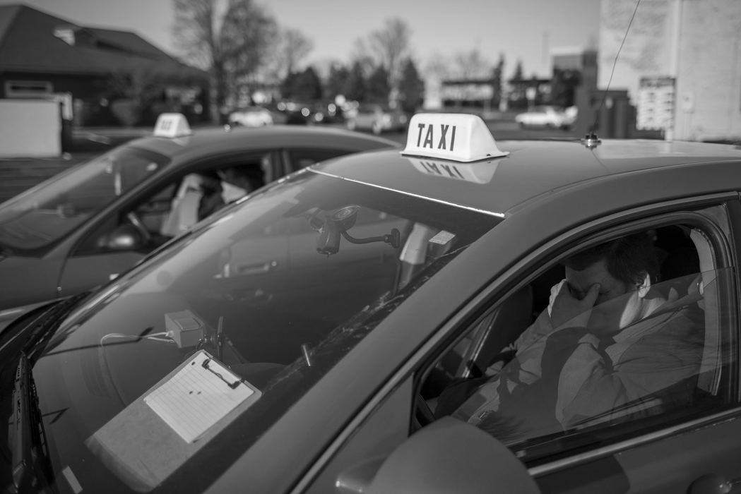 Harry Steininger waits in his car along with other Dublin Taxi drivers to get dispatched one afternoon on Wednesday, March 8, 2017 in Dublin, Ohio. He works the third shift, from 3:30 p.m. to 5 a.m., usually six days a week. Steininger, who’s driven a cab since 2003, used to pull in about $70,000 a year but his income has dropped to about $27,000 a year now that other ride-sharing services such as Uber and Lyft operate in Columbus. “We’ll never see them days again,” he said of the living he used to earn. Right now, he's working to save up a few thousand dollars to buy a small mobile home outside of the city.