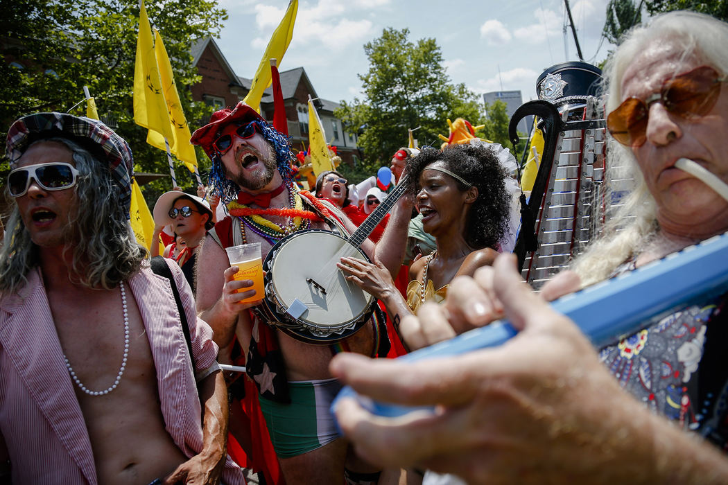 Parade marchers sing the Star-Spangled Banner as they prepare to march during the Doo Dah Parade on Tuesday, July 4, 2017 in Columbus, Ohio.