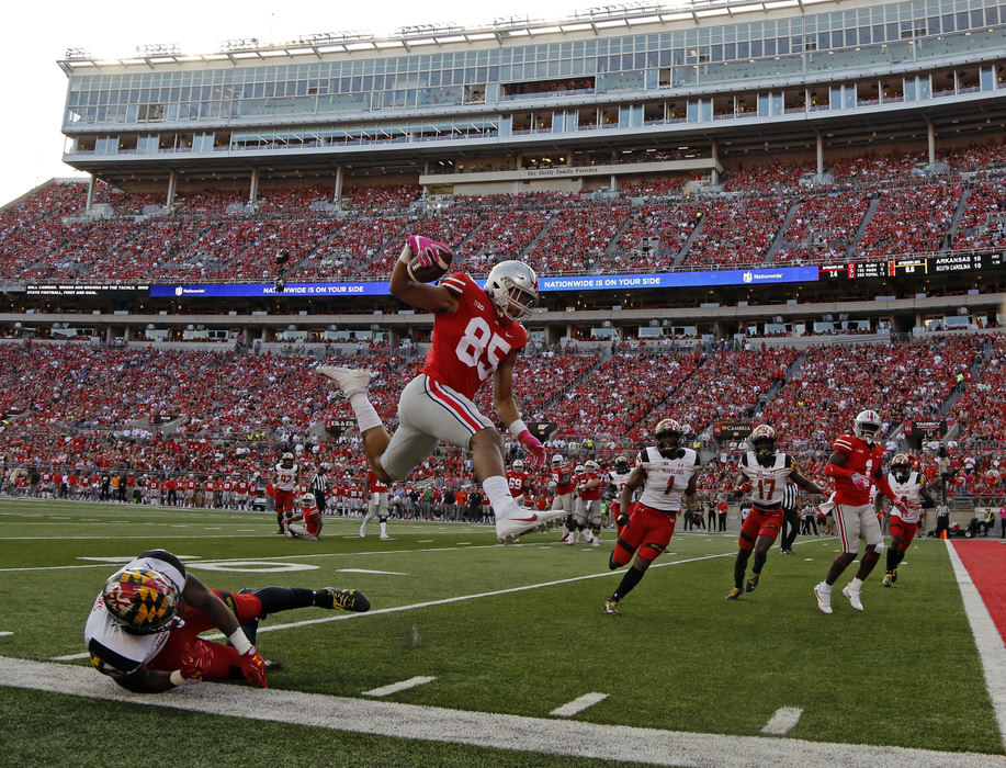 Ohio State Buckeyes tight end Marcus Baugh (85) jumps into the air to score a touchdown after a catch during the 2nd quarter at Ohio Stadium in Columbus, Ohio on October 7, 2017.  