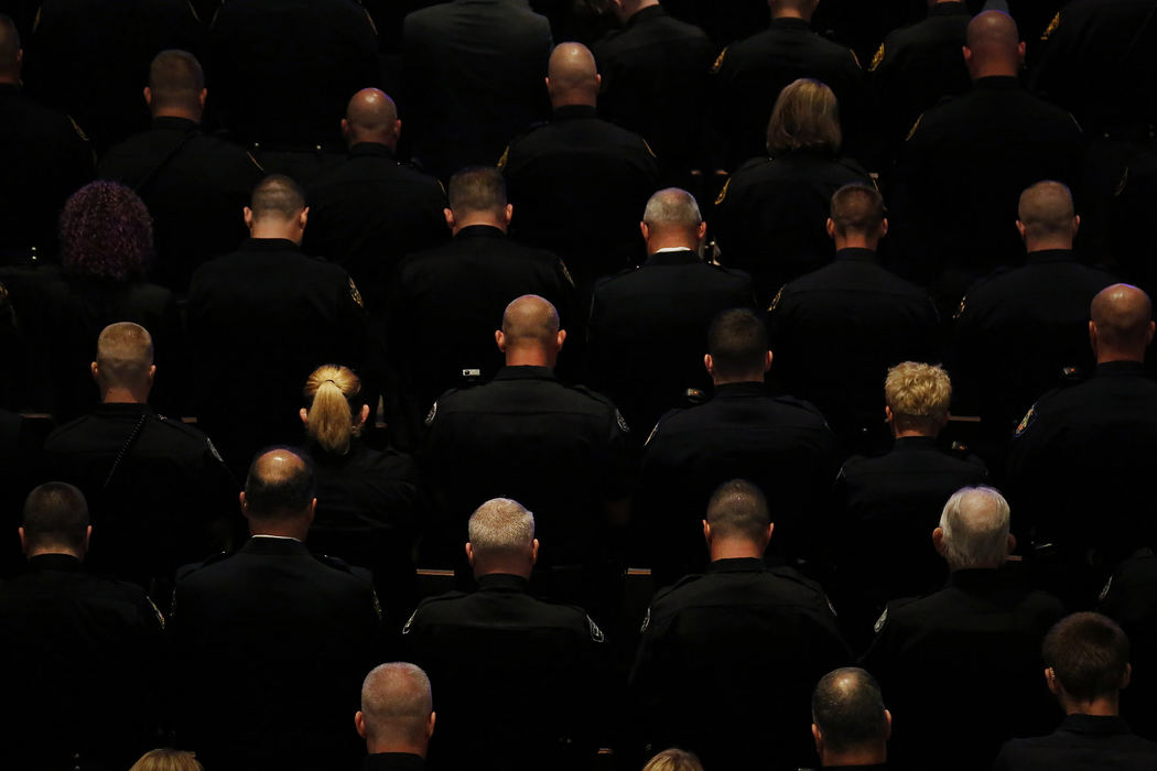 Law enforcement officers bow their heads in prayer during the funeral of Kirkersville Police Chief Steven Eric DiSario on Saturday, May 20, 2017 at Church of the Nazarene in Grove City, Ohio. DiSario, along with nurse's aides Cindy Krantz and Marlina Medrano, were killed on Friday, May 12, 2017 outside the Pine Kirk Care Center in Kirkersville. The gunman, Thomas Hartless, 43, of Utica, took two passers-by hostage in a wooded area DiSario encountered him. Hartless, who was in a former relationship with Medrano, was later found dead inside the nursing home along with Krantz and Medrano.