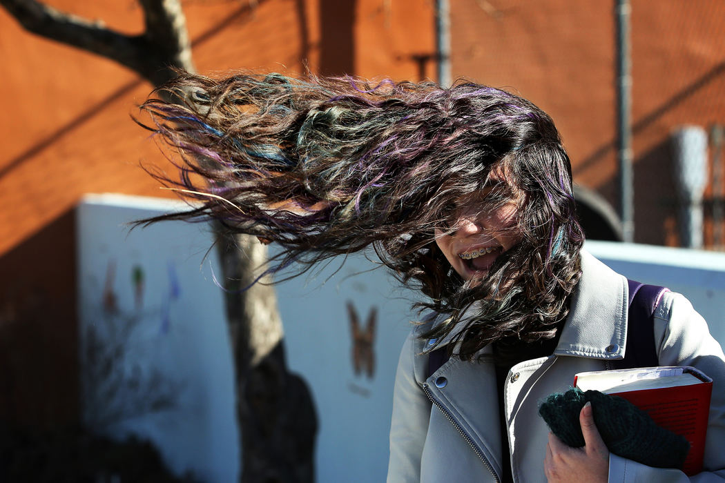fea"I can't get my hair back!" Mckayla Mejia, 15, laughed as she checked her phone after school Wednesday, March 8, 2017, in central Toledo. High winds swept through the greater Toledo area Thursday. 