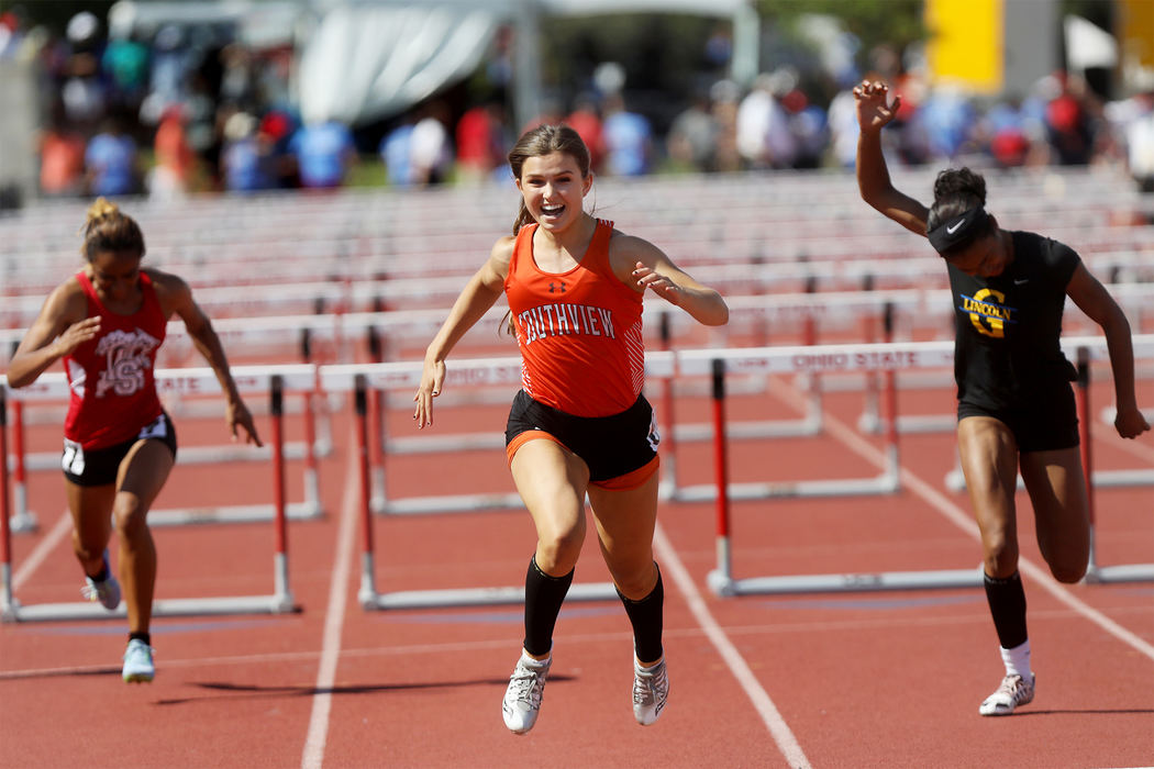 Southview's Lauren Micham smiles as she crosses the finish line to win the Division I 100 meter hurdles at the OHSAA 43d Annual Girls State Track and Field Tournament Saturday, June 3, 2017, at Jesse Owens Memorial Stadium in Columbus. Her time of 13.66 seconds broke the stadium record and put her in second place for the all-time state record in all divisions. 