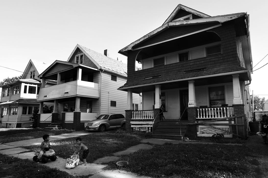 Invisible and pervasive, the scourge of childhood lead poisoning is a persistent problem often caused by exposure in housing. Though lead paint was banned for home use in 1978, many older properties remain contaminated. Many families in rental properties are unaware of in-home contamination, and low-income home owners struggle to afford lead abatement as children incur irreversible lead poisoning. Across Ohio, health departments are evicting renters and owners from homes that are non-compliant with ordered lead abatement. Children play outside a house with identified lead hazards Wednesday, August 16, 2017, in Cleveland. The house was one of nearly 90 in Cuyahoga County for whom the Board of Health has issued Orders of Eviction. The identified houses were noncompliant with ordered lead abatement, a process triggered once a child staying at the residence tests positive for elevated lead levels. The family living at this property said they weren't interested in learning of the eviction order. 