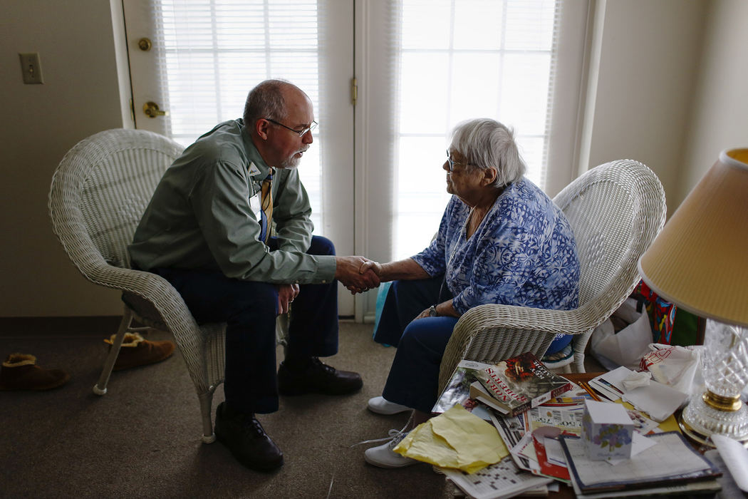 Hospice chaplain John Cramton, left, says a prayer with patient Gretchen Haas, 80, on Friday, March 10, 2017 in her assisted care apartment at Whetstone Care Center in Columbus, Ohio. Cramton and his employer, OhioHealth, help train local people of faith on how to visit and counsel people in hospital care so they can help ease the work load of hospital-employed chaplains.