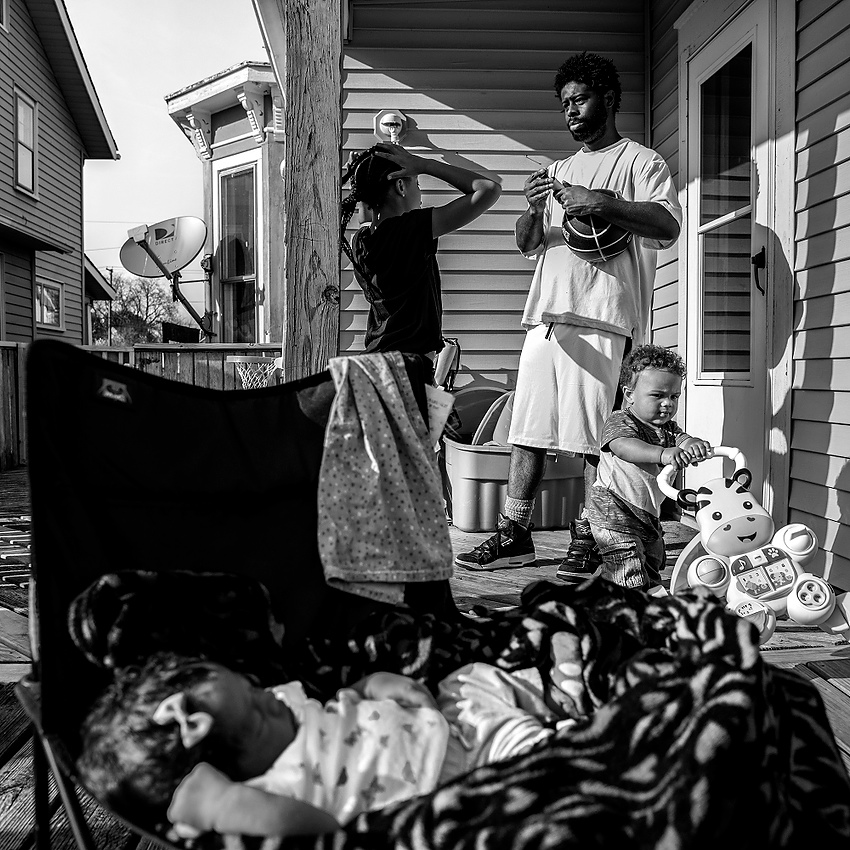 First Place, George S. Smallsreed Photographer of the Year  - Jessica Phelps / Newark AdvocateDesmond is always surrounded by his children. They seem to orbit around him wanting his love and attention. And Desmond is always happy to oblige, even when he pretends he is not. 