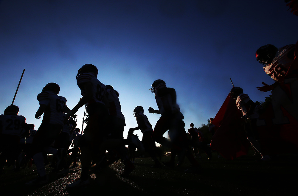 Second Place, George S. Smallsreed Photographer of the Year  - Lorrie Cecil / ThisWeek Community NewsGroveport Madison takes the field for their game at Thomas Worthington on Friday September 8.   