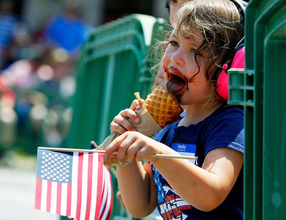 Second Place, George S. Smallsreed Photographer of the Year  - Lorrie Cecil / ThisWeek Community NewsThree year old Elena Ehmann of Dublin, enjoys her ice cream as she and her brother Ray, five, watch the Dublin Independence Day Parade on Tuesday July 4, 2017.   The parade was followed later in the day with a festival at Dublin Coffman High School which included a kids area, music highlighted by a performance from Peter Frampton and fireworks.  
