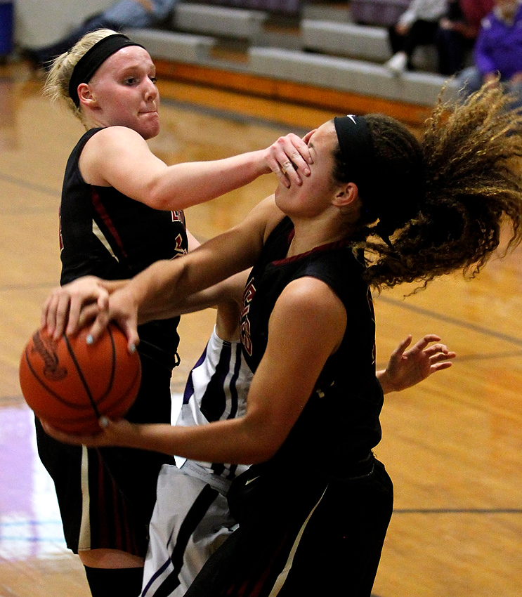 Second Place, George S. Smallsreed Photographer of the Year  - Lorrie Cecil / ThisWeek Community NewsNew Albany's Josie Smith isn't very helpful on this play as she accidently covers the eyes of teammate Micaylah Nash during their game at DeSales on Wednesday December 6.  