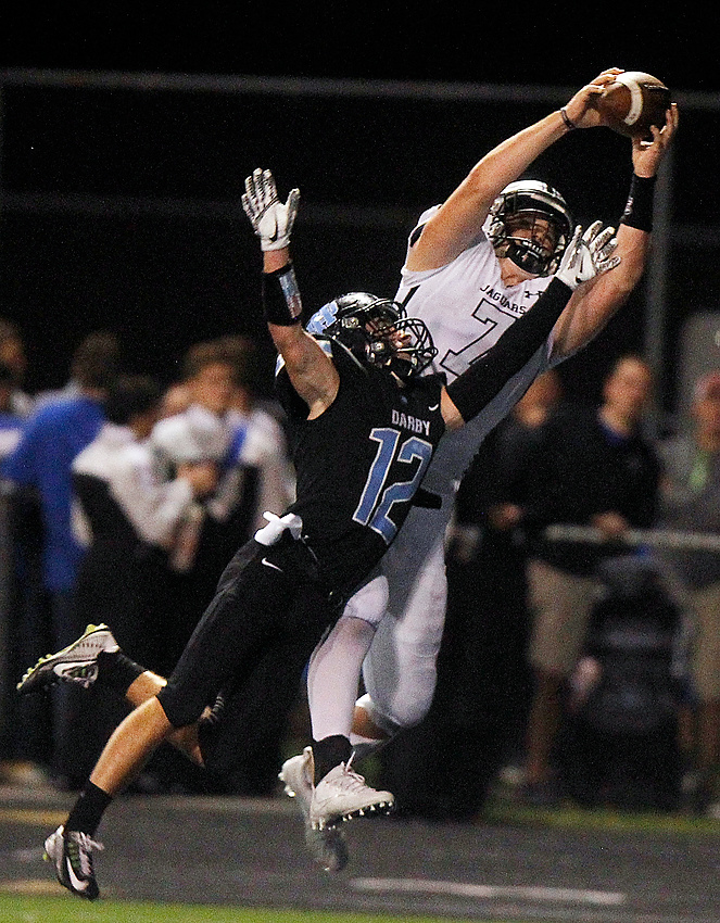 Second Place, George S. Smallsreed Photographer of the Year  - Lorrie Cecil / ThisWeek Community NewsHilliard Bradley High School’s Zach Hummel snares a pass in the end zone over Hilliard Darby’s Ian Coverstone to put Bradley up 20-7 during the second half of a game at Darby on Sept. 15. Bradley went on to win 21-7. A dynamic offense and a stingy defense helped the Jaguars finish the regular season unbeaten and earn the program’s first playoff victory; their postseason run was ended by the eventual state champions, the Pickerington Central Tigers, in a Division I, Region 3 semifinal.