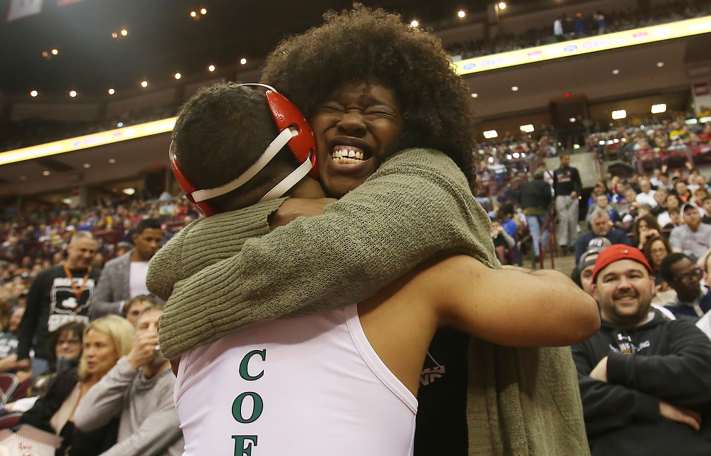 Second Place, George S. Smallsreed Photographer of the Year  - Lorrie Cecil / ThisWeek Community NewsChar Demas hugs her son, Dublin Coffman's Dom Demas after he defeated Olentangy Liberty's Trey Grenier in the 145 to win the Division I state title at the 80th Annual State Wrestling Tournament at the Schottenstein Center on Saturday March 11.  