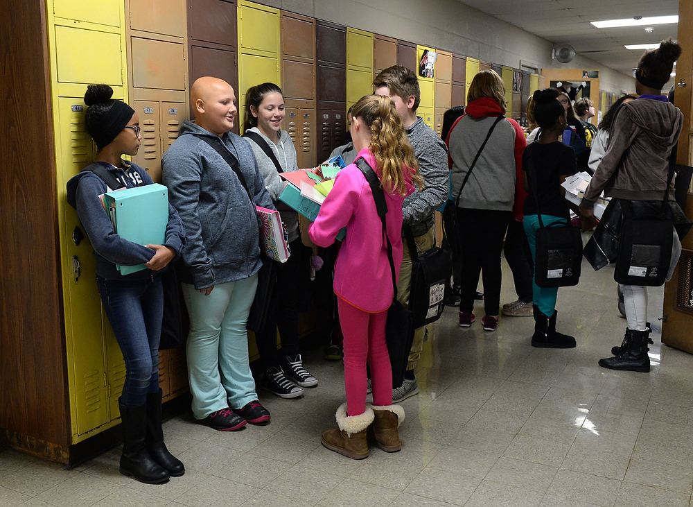 Third Place, George S. Smallsreed Photographer of the Year  - Erin McLaughlin / Sandusky RegisterDuring a break between classes, Karah talks with her sixth-grade classmates in the hallway at Briar Middle School on Dec. 6, 2017.