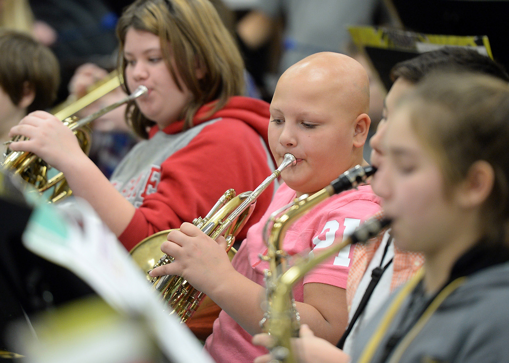 Third Place, George S. Smallsreed Photographer of the Year  - Erin McLaughlin / Sandusky RegisterKarah plays the French horn during band class at Briar Middle School on Dec. 6, 2017. One of Karah's favorite classes is band because she loves music.