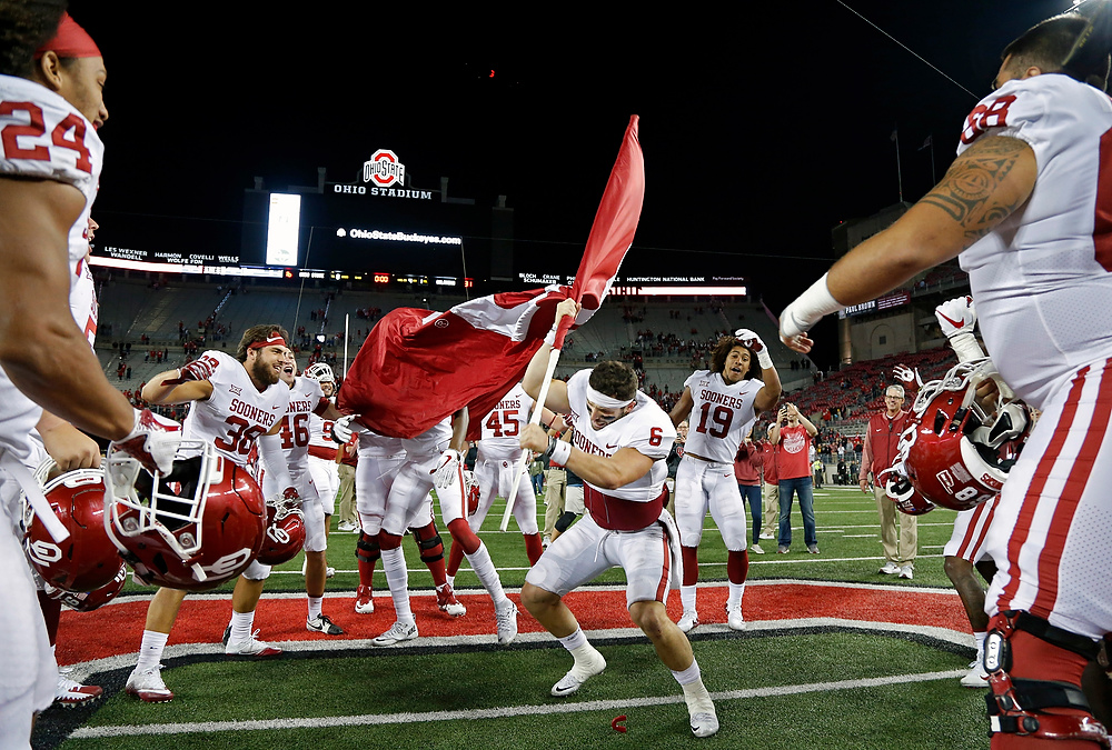 , Ron Kuntz Sports Photographer of the Year - Kyle Robertson / Columbus DispatchOklahoma Sooners quarterback Baker Mayfield (6) plants the Sooner flag in the Ohio State logo at midfield after beating Ohio State Buckeyes 31-16 at Ohio Stadium in Columbus, Ohio on September 9, 2017. 