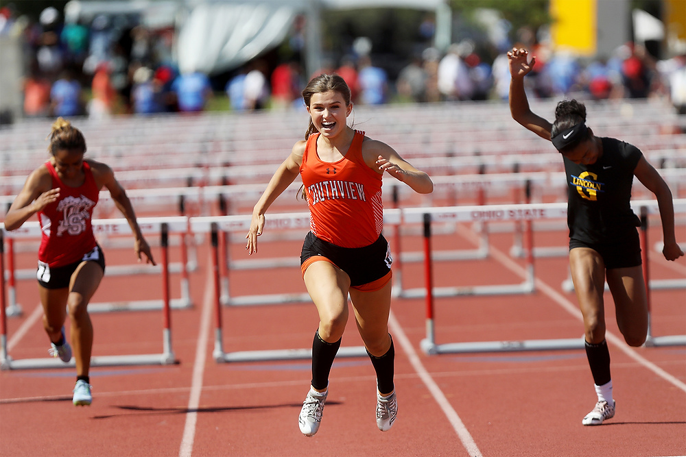 Second Place, Ron Kuntz Sports Photographer of the Year - Katie Rausch / The Blade/Katie RauschSouthview's Lauren Micham smiles as she crosses the finish line to win the Division I 100 meter hurdles at the OHSAA 43d Annual Girls State Track and Field Tournament Saturday, June 3, 2017, at Jesse Owens Memorial Stadium in Columbus. Her time of 13.66 seconds broke the stadium record and put her in second place for the all-time state record in all divisions. 