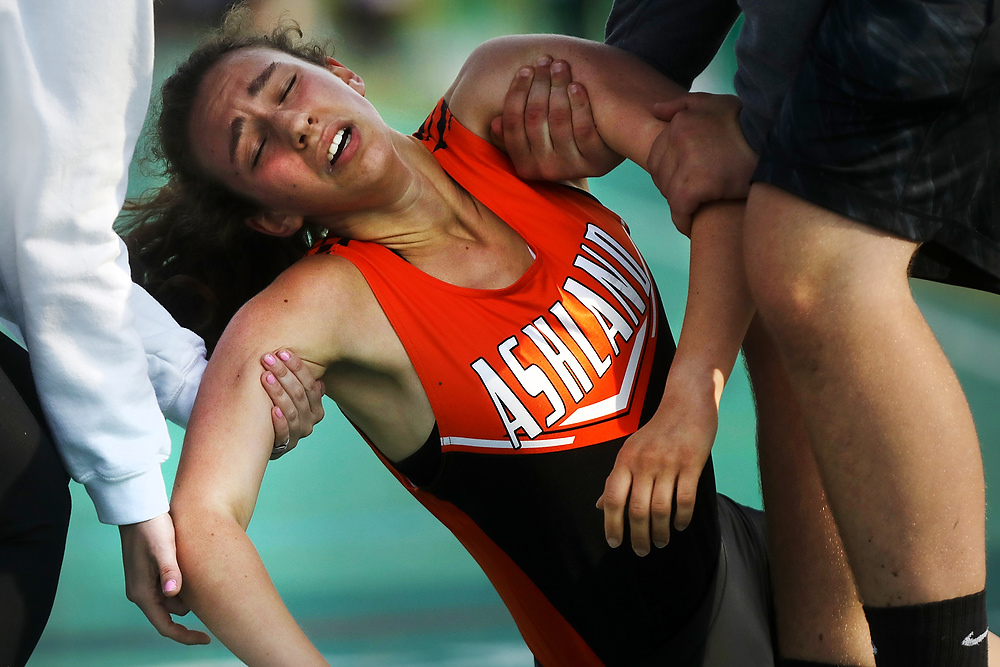 Second Place, Ron Kuntz Sports Photographer of the Year - Katie Rausch / The Blade/Katie RauschAshland's Healther Jamieson is carried off the track after collapsing at the finish line of the 1600 Meter Run at the Division I Region 2 Track and Field Championship meet Friday, May 26, 2017, at Amherst Steele High School. 