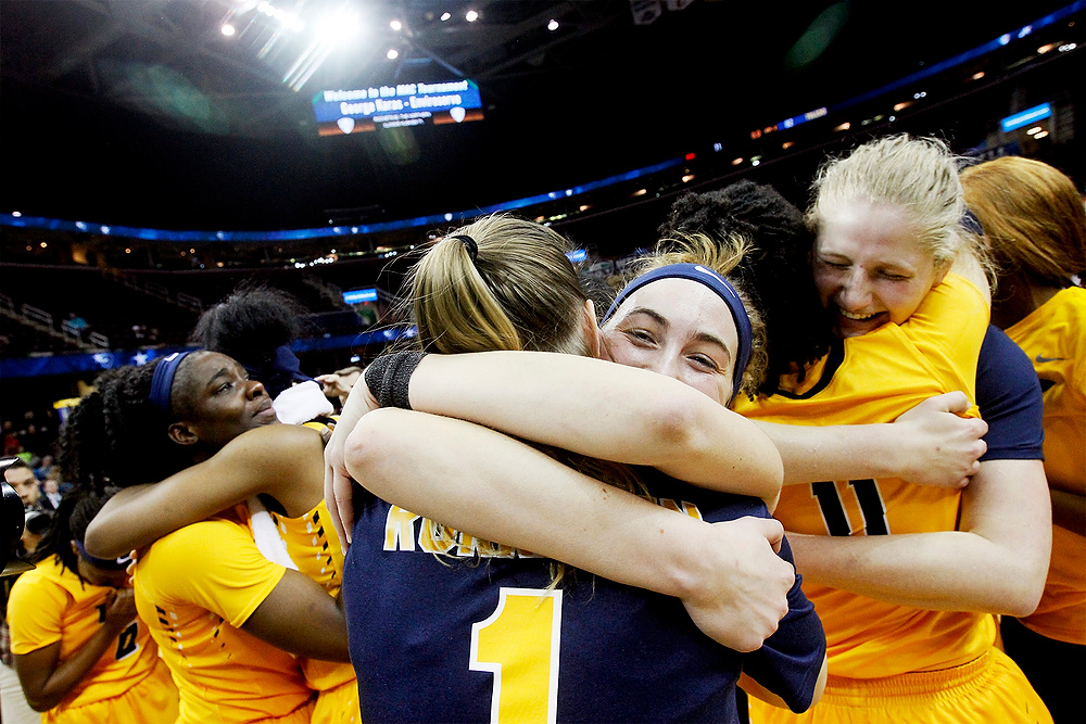 Second Place, Ron Kuntz Sports Photographer of the Year - Katie Rausch / The BladeFrom left: Toledo's Janice Monakana is hugged by Kaayla McIntyre as Mariella Santucci, center, embraces by Sara Rokkanen (1) and Jay-Ann Bravo-Harriott (11) hugs Sophie Reecher, right, after they beat Northern Illinois to win the Saturday, March 11, 2017, women's basketball MAC Championship match up at the Quicken Loans Arena in Cleveland. Toledo won, 82-71. 