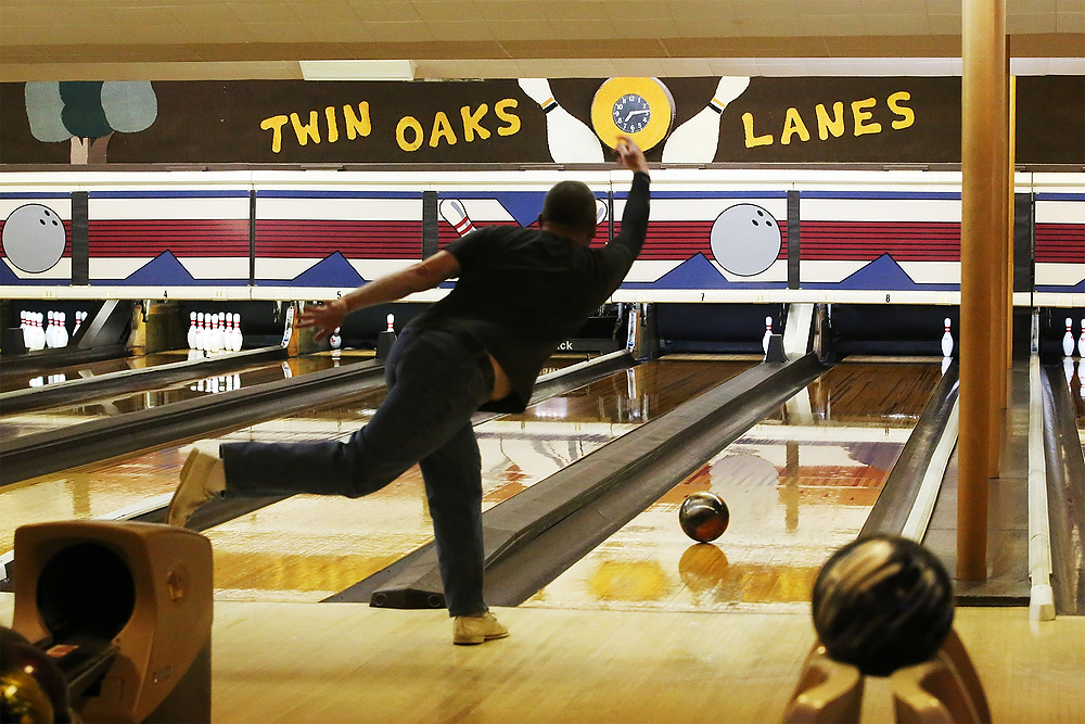 Second Place, Ron Kuntz Sports Photographer of the Year - Katie Rausch / The Blade/Katie RauschMembers of the all-male Kenny Mummert Memorial League cherish their old alley and old friendships as they bowl together at Twin Oakes Lanes in North Toledo. The bowling alley opened on Dec. 7, 1941 and is now celebrating its 75th year in business. The two trees the alley is named for are gone, but the 12 lanes of bowling and countless memories remain.Todd Rowland tries to pick up a last pin while bowling with the Kenny Mummert Memorial League Monday, April 24, 2017, at Twin Oakes Lanes in North Toledo. 