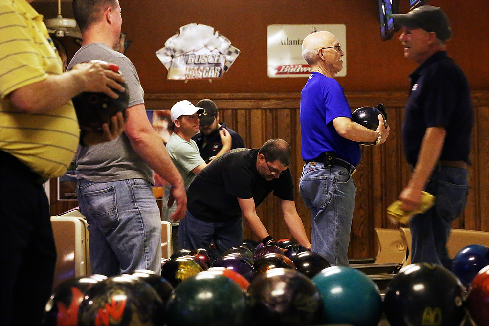 Second Place, Ron Kuntz Sports Photographer of the Year - Katie Rausch / The Blade/Katie RauschDave McHenry, center right, lines up his shot as he bowls with other members of the Kenny Mummert Memorial League at Twin Oakes Lanes in North Toledo. 